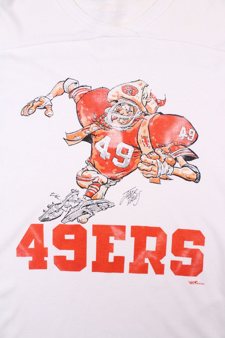 Vintage San Francisco 49ers NFL Jack Davis Graphic Jersey T-Shirt in a white colourway with the spell out logo and Jack Davis football illustration graphic printed on the front.