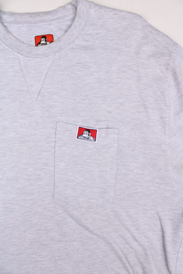 Vintage Ben Davis Long-Sleeve Pocket T-Shirt in a grey colourway, has a chest pock with the logo embroidered on the front.