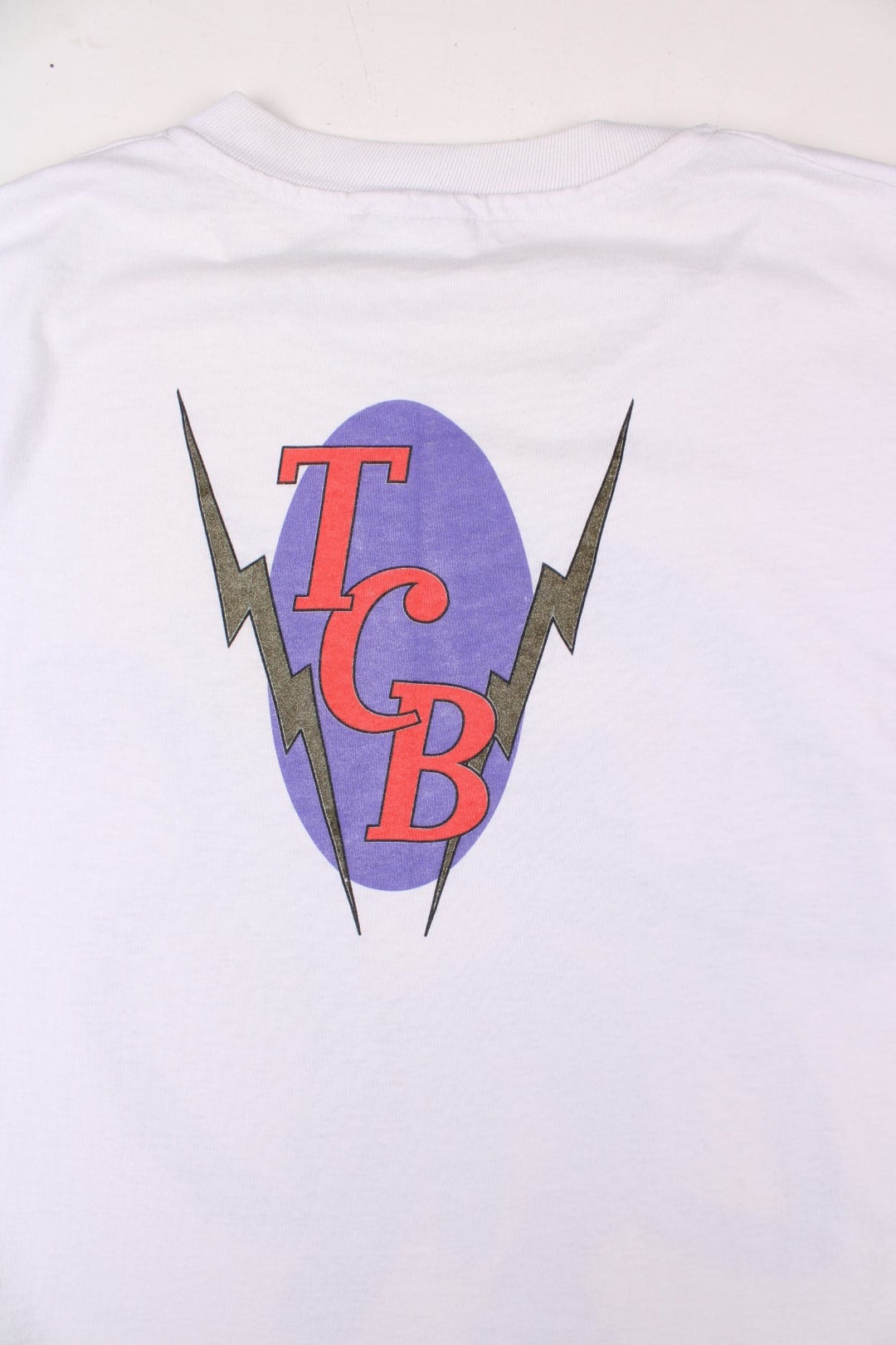 Vintage 1994 Elvis Presley Graphic single stitch T-Shirt in a white colourway with the artist graphic printed on the front, and TCB spell out printed on the back.