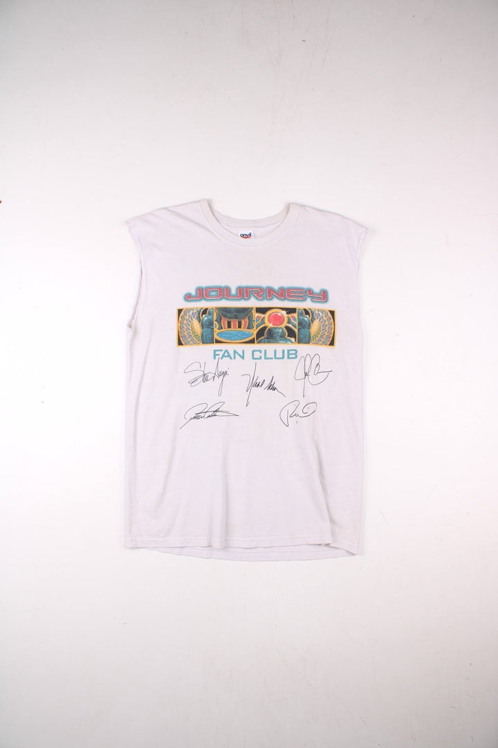 Vintage 2001 Journey Arrival Tour Signed Fan Club Vest T-Shirt in a white colourway with the spell out and graphic printed across the front alongside the bands signatures (not actually signed but printed onto the t-shirt) and has the tour dates printed on the back.