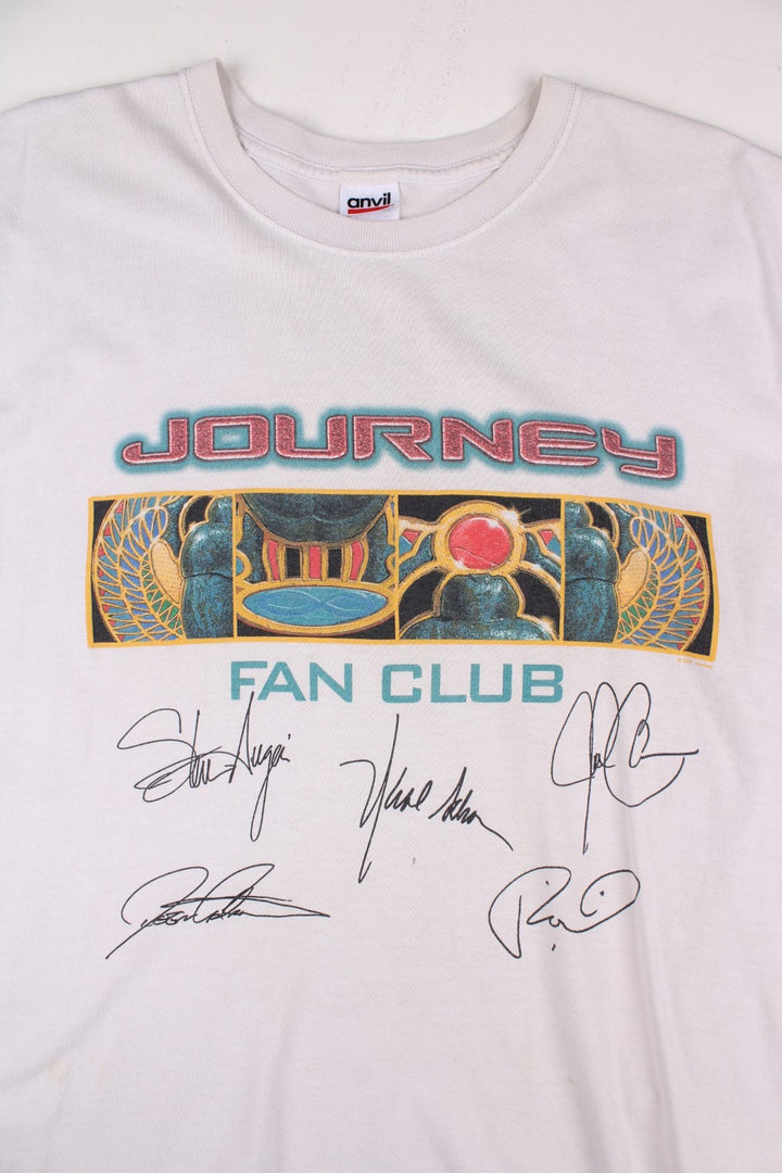 Vintage 2001 Journey Arrival Tour Signed Fan Club Vest T-Shirt in a white colourway with the spell out and graphic printed across the front alongside the bands signatures (not actually signed but printed onto the t-shirt) and has the tour dates printed on the back.