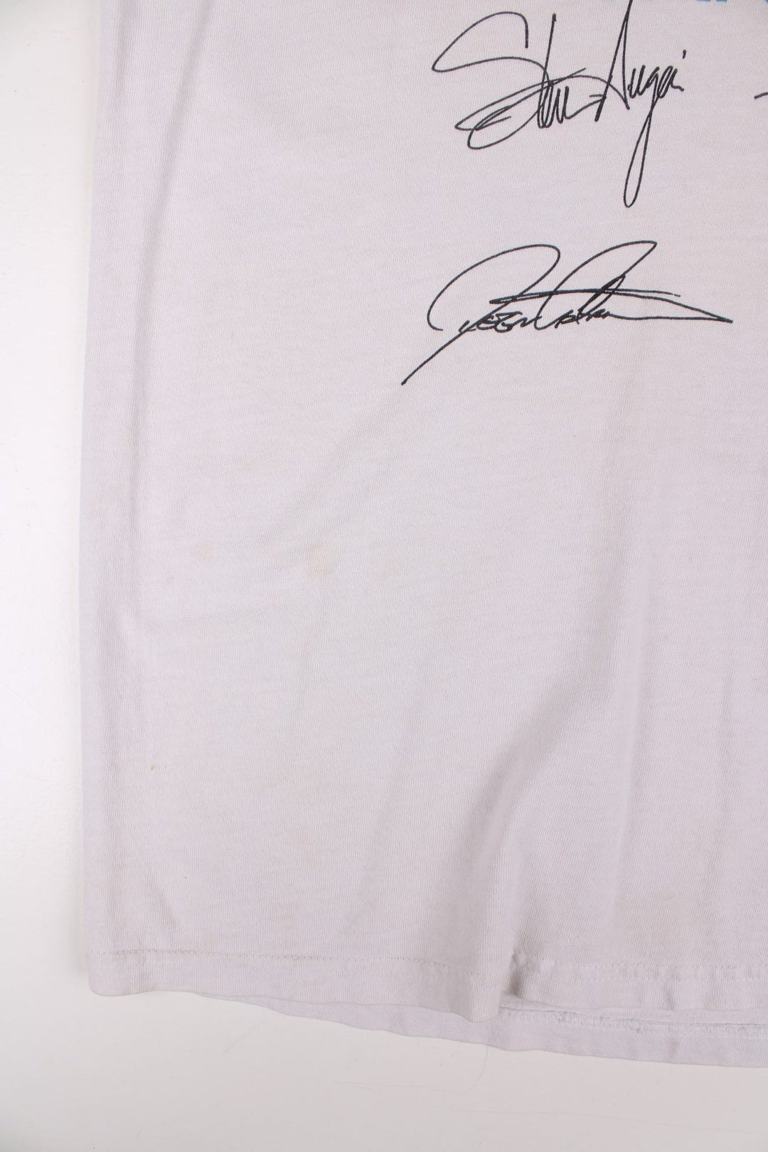 Vintage 2001 Journey Arrival Tour Signed Fan Club Vest T-Shirt in a white colourway with the spell out and graphic printed across the front alongside the bands signatures (not actually signed but printed onto the t-shirt) and has the tour dates printed on the back.