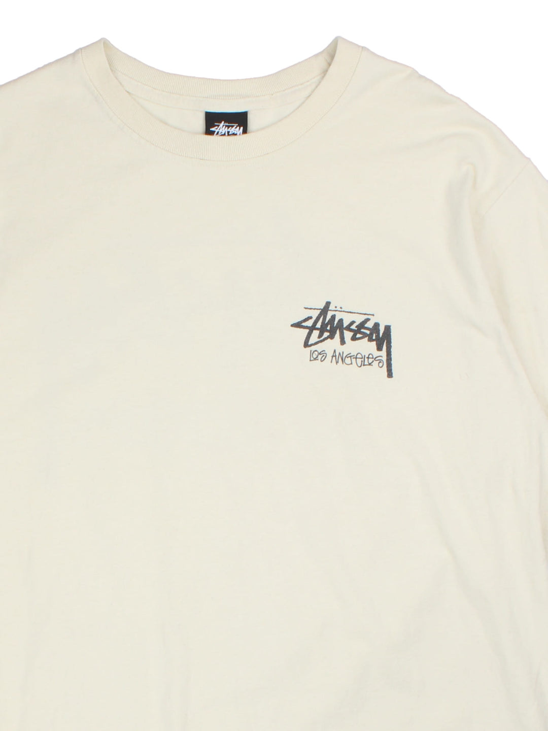 Stussy t-shirt in a white colourway, graphic printed on front and back.