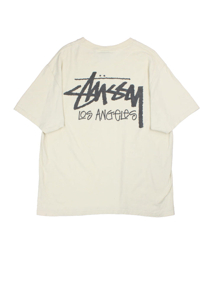 Stussy t-shirt in a white colourway, graphic printed on front and back.