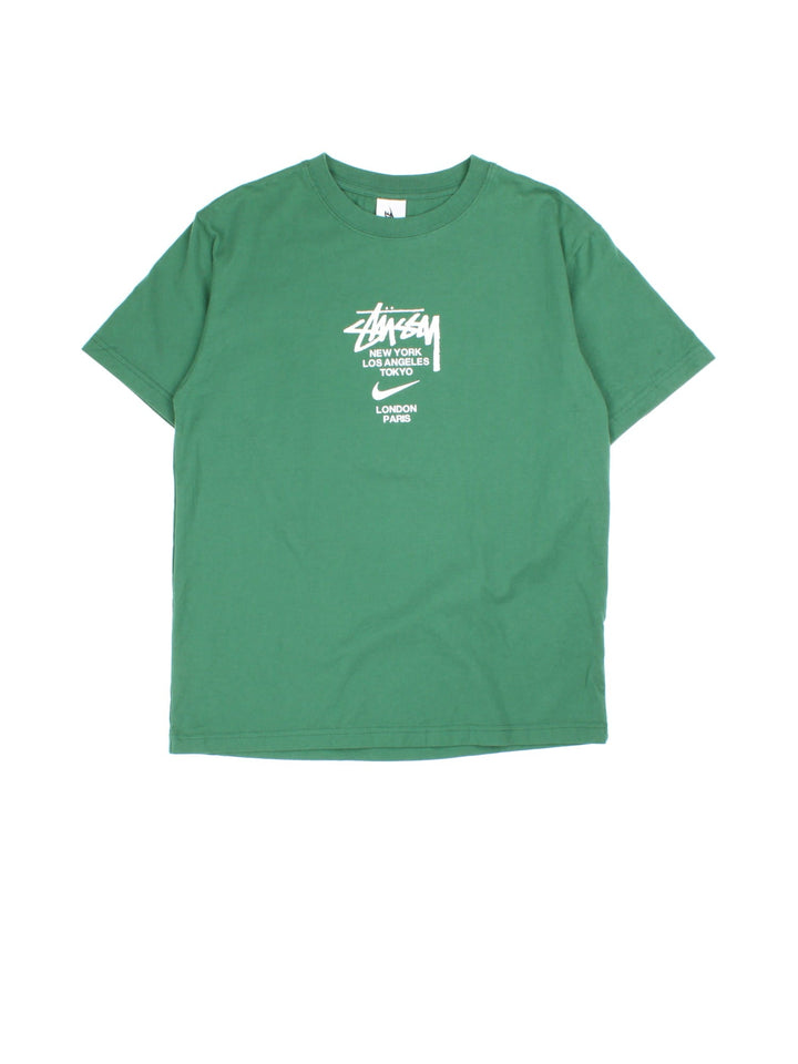 Vintage Nike x Stussy T-shirt in a green colourway, branding printed on front.