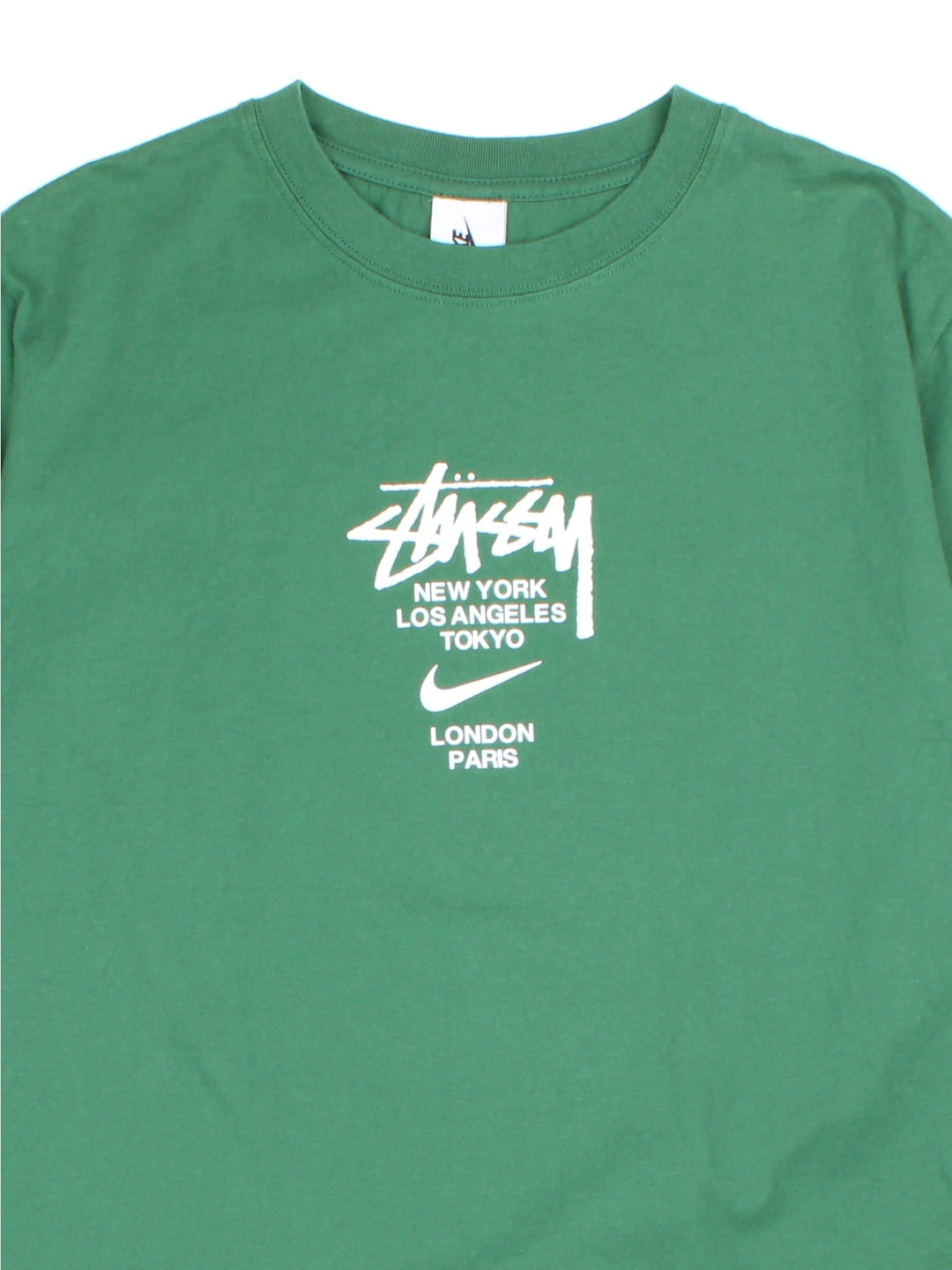 Vintage Nike x Stussy T-shirt in a green colourway, branding printed on front.