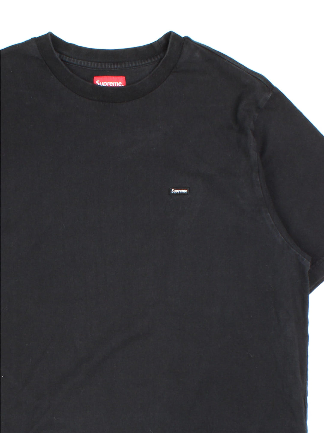 Vintage Supreme T-shirt in a black colourway, embroidered logo patch on front.