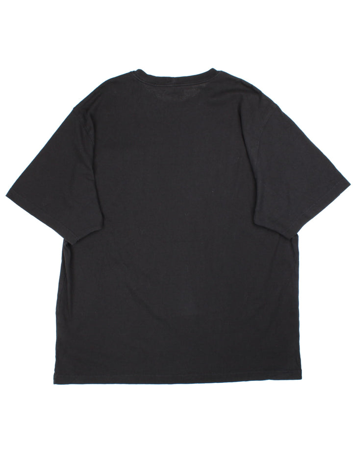 Carhartt T-shirt in a black colourway, branding on front pocket.