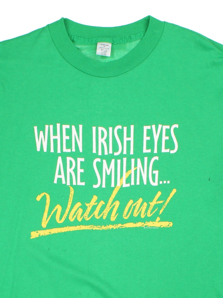 Vintage When Irish Eyes Are Smiling.. Watch Out Graphic T-Shirt in a green colourway with the spell out printed on the front.