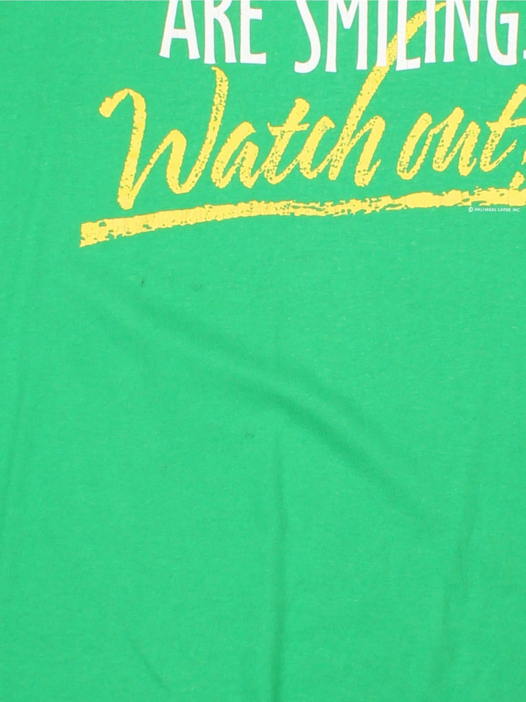 Vintage When Irish Eyes Are Smiling.. Watch Out Graphic T-Shirt in a green colourway with the spell out printed on the front.