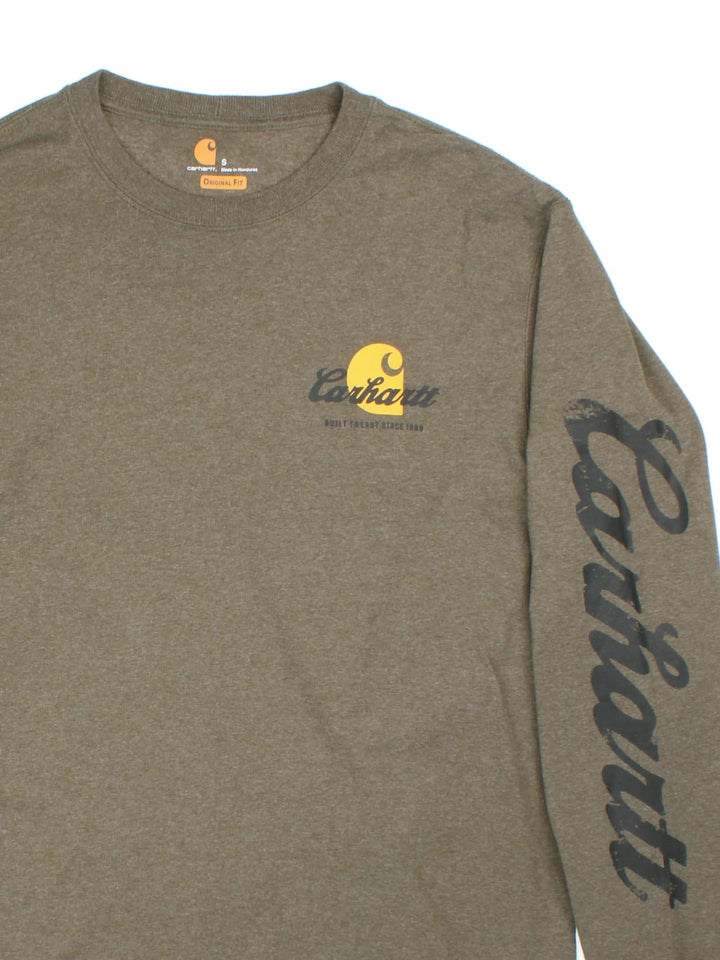 Carhartt Long Sleeve T-Shirt in a green colourway with brand name graphic down the sleeve and small graphic on the front.