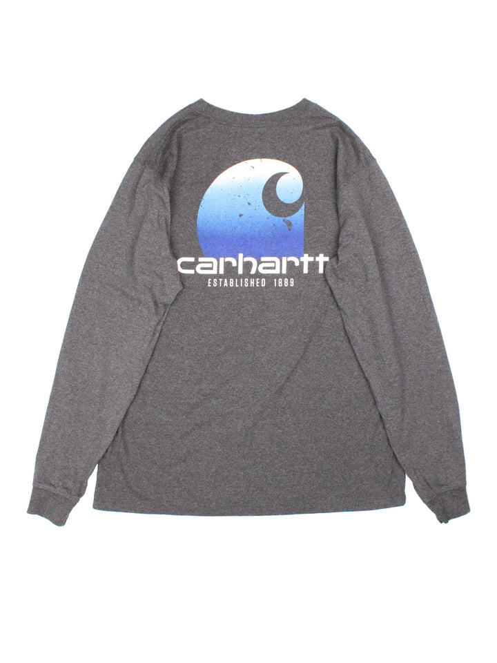 Carhartt Long Sleeve T-Shirt in a grey colourway with pocket and small logo on the front and large graphic on the back..