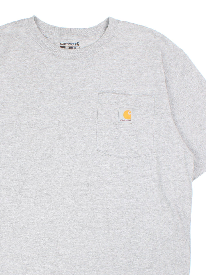 Carhartt T-Shirt in a grey colourway with small logo and pocket on the front.