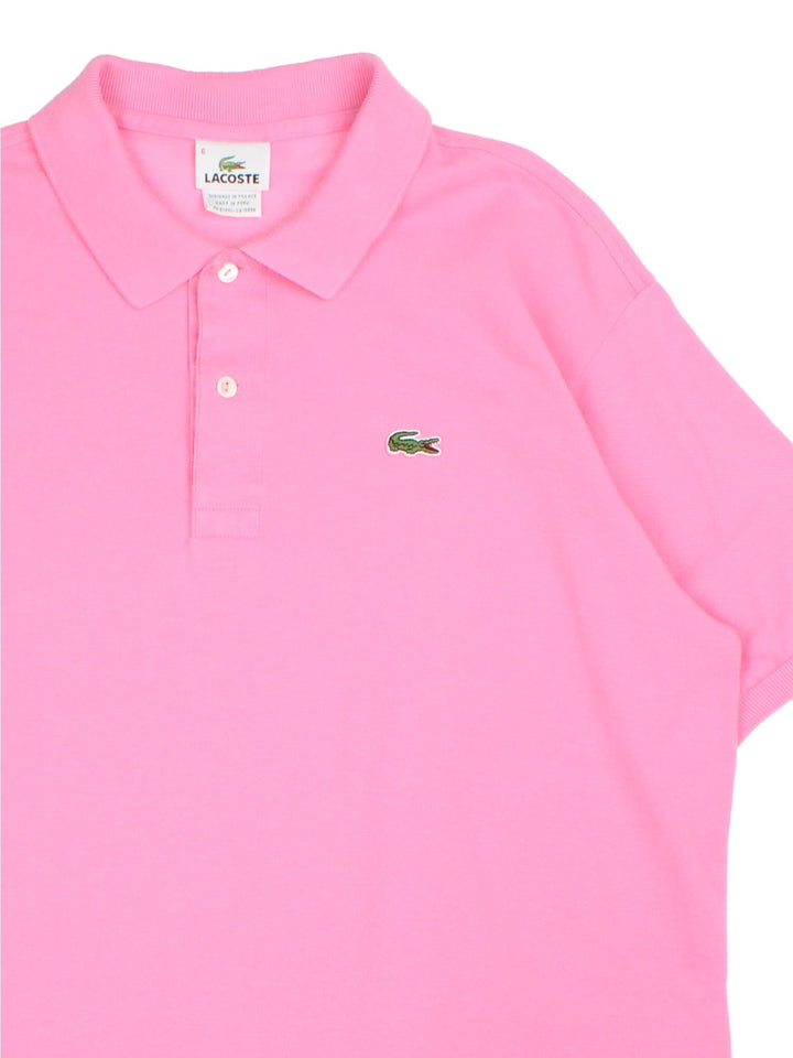 Lacoste Polo Shirt in a pink colourway with classic logo on on the front.