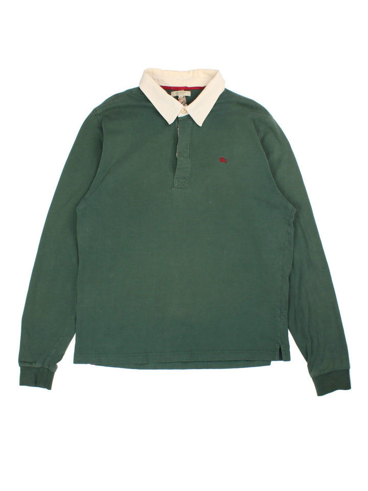 Burberry Long Sleeve Polo Shirt in a green colourway with beige collar and small logo on the front. Classic Nova check detailing inside the button up front.