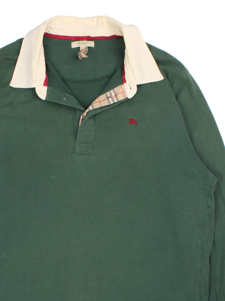 Burberry Long Sleeve Polo Shirt in a green colourway with beige collar and small logo on the front. Classic Nova check detailing inside the button up front.