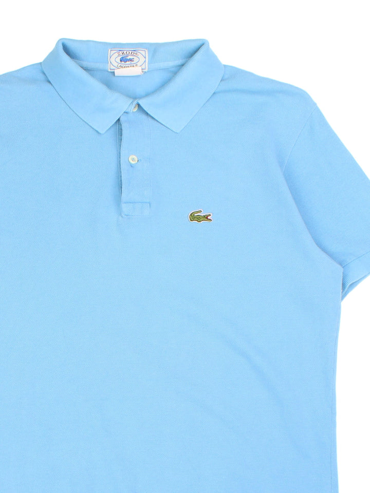 Lacoste IZOD Polo Shirt in a blue colourway with classic logo on the front.