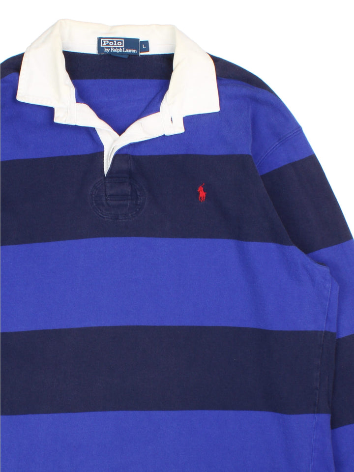 Ralph Lauren Rugby Shirt in a blue colourway with striped pattern. White collar and small classic logo on the front.