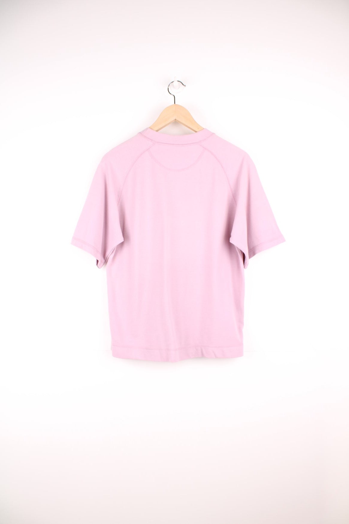 Pale pink Reebok Freestyle spellout t-shirt with small logo tag on left sleeve, and &