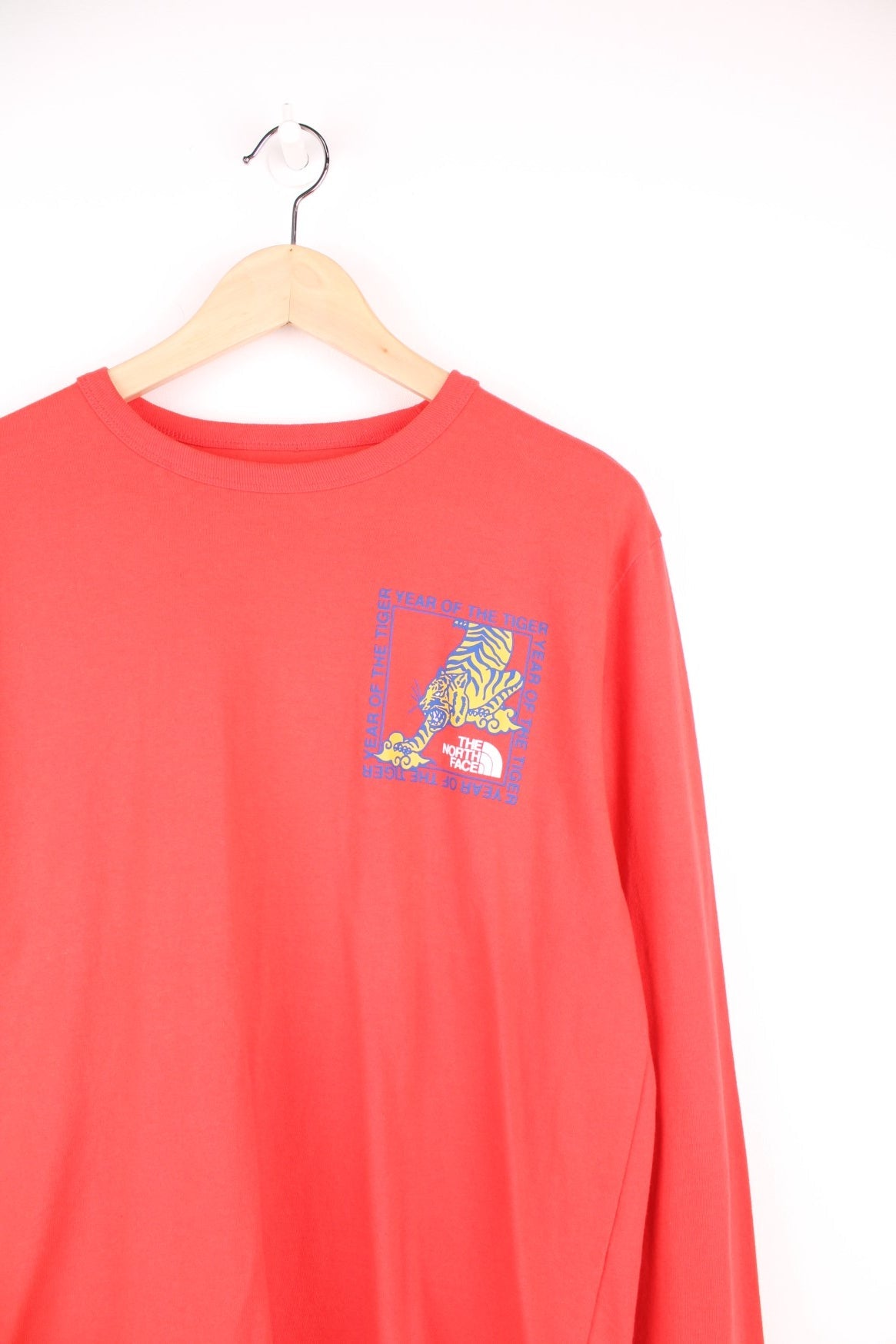 Red North Face long-sleeved t-shirt with &