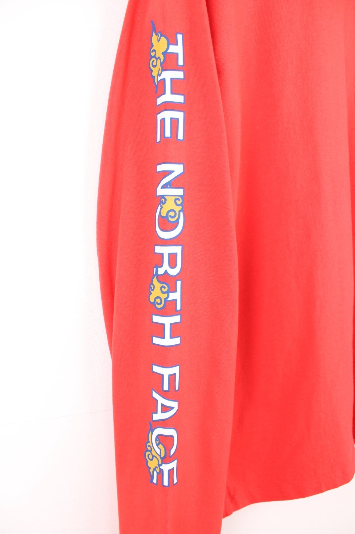 Red North Face long-sleeved t-shirt with &