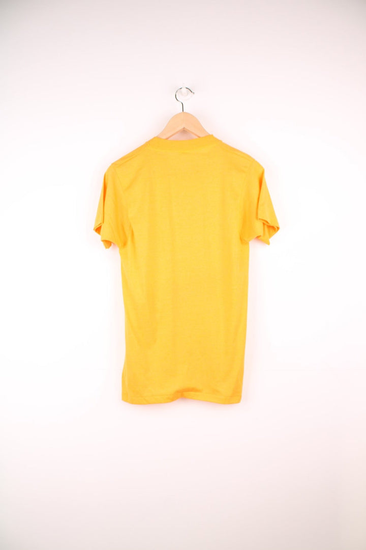 Yellow 'Skate or be stupid' spellout tee. 