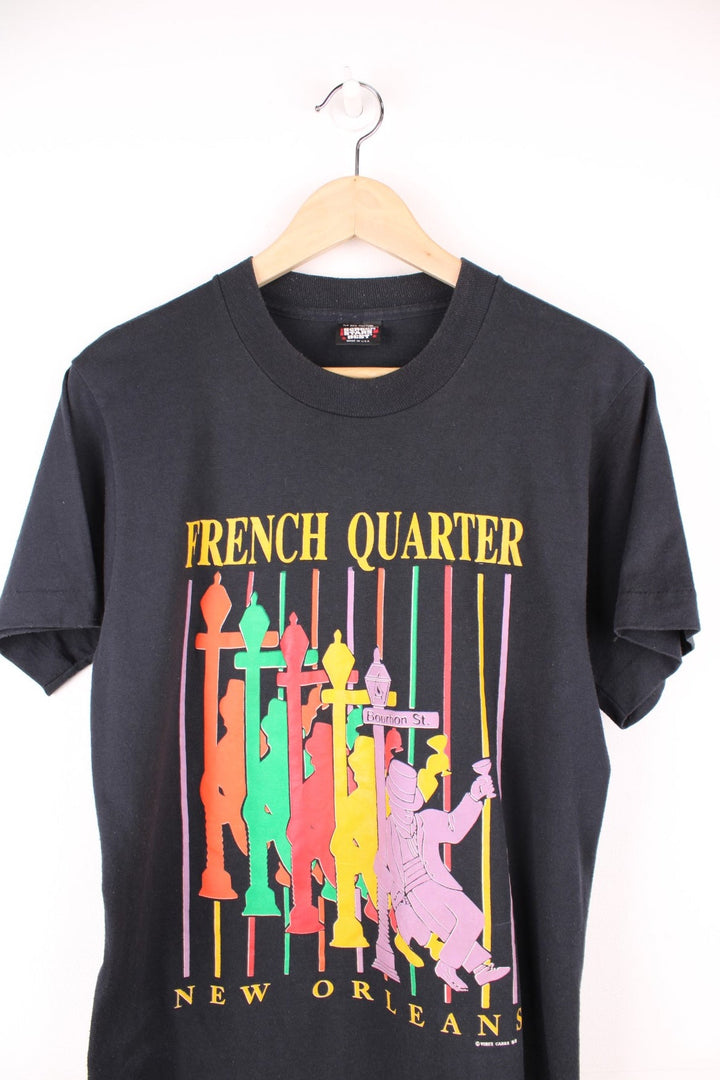 French Quarter, New Orleans tee in black with multicoloured silhouette design and Bourbon St. sign. 