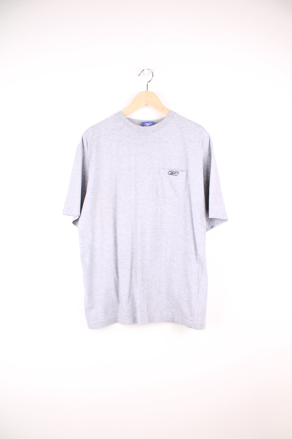 Grey Reebok tee with breast pocket and small embroidered logo. 