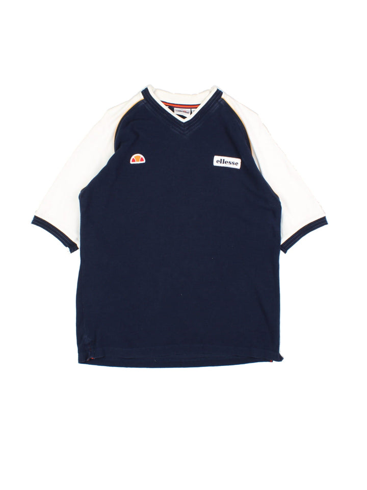 Vintage Ellesse T-Shirt in a blue and white colourway, v neck collar and has the logos embroidered on the front.