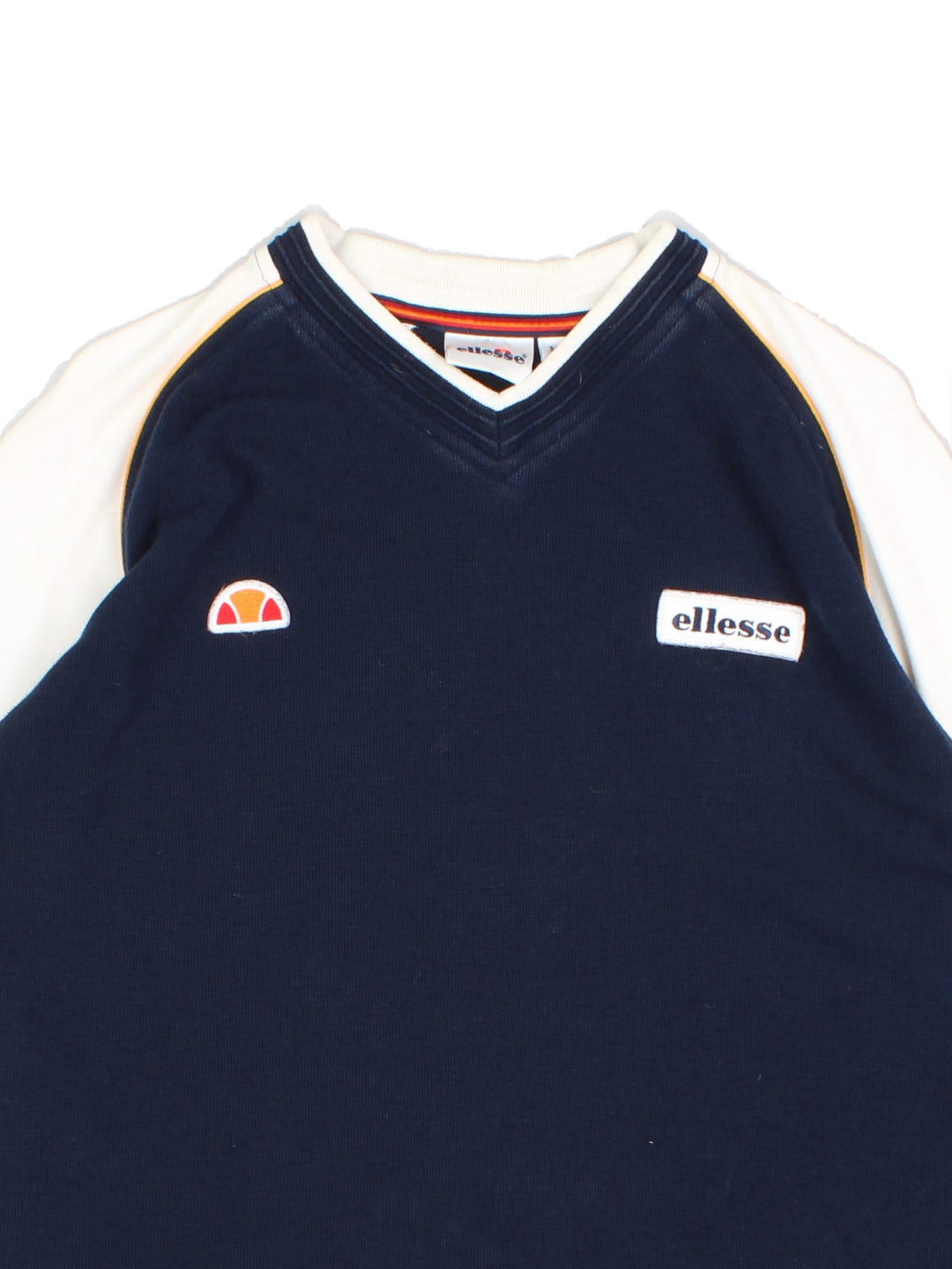 Vintage Ellesse T-Shirt in a blue and white colourway, v neck collar and has the logos embroidered on the front.