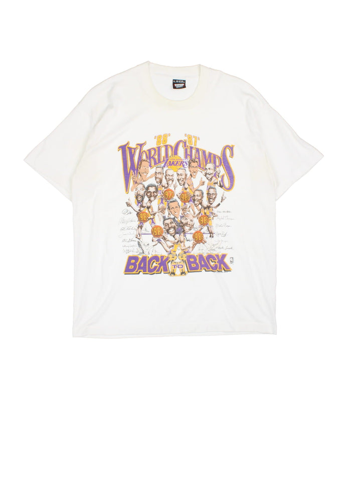 Vintage Los Angeles Lakers NBA World Champs Salem Screen Printers T-Shirt in white with team cartoon graphic and spell out printed on the front.