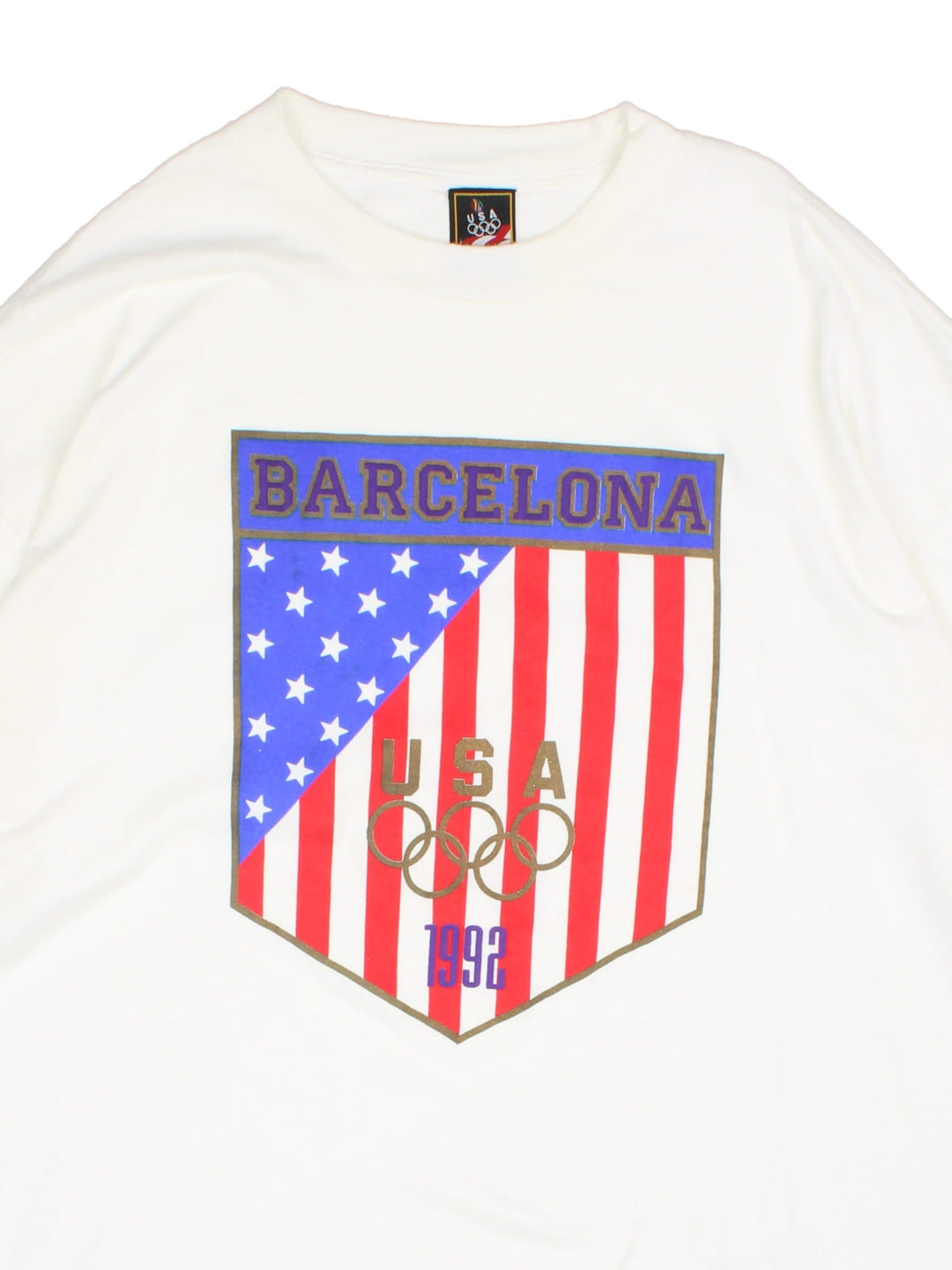 1992 Vintage Barcelona USA Olympics USA T-Shirt in white with graphic printed on the front.