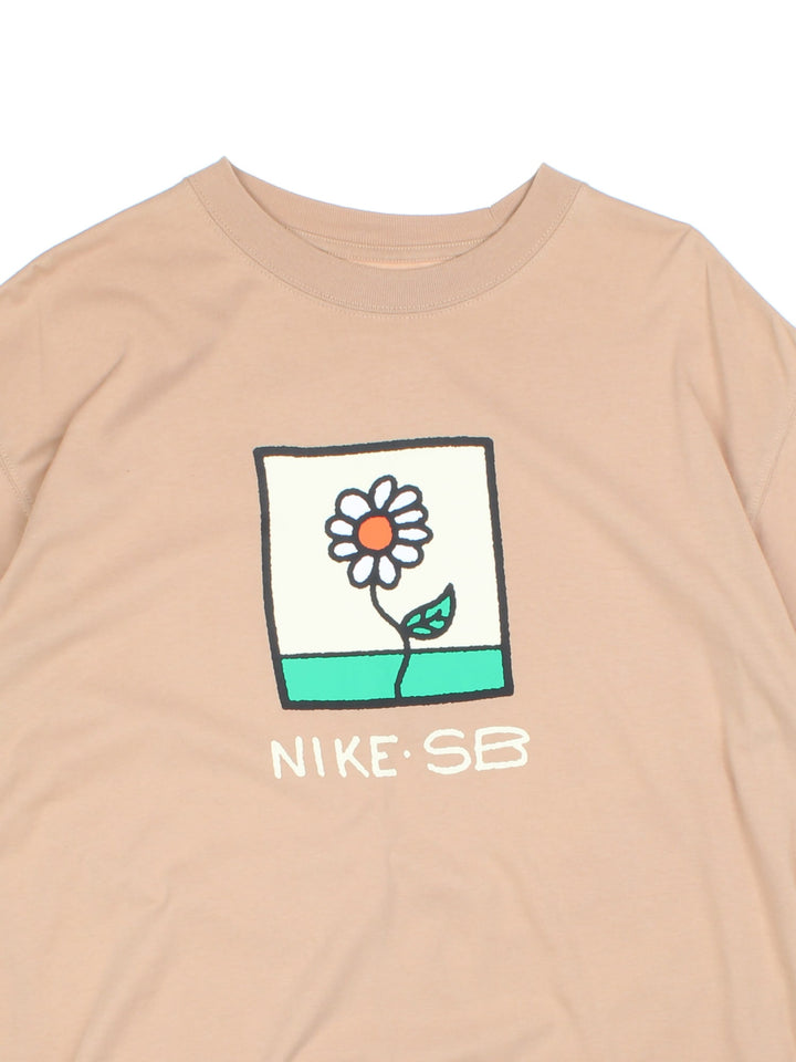 Vintage Nike SB T-Shirt in tan with flower graphic printed on the front.