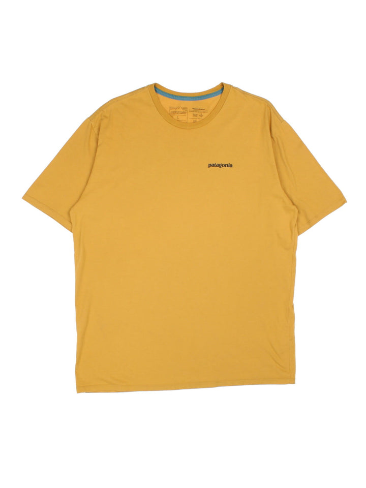 Patagonia Logo T-Shirt in a mustard yellow colourway with large logo graphic on the back and small logo on chest.