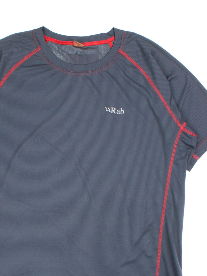 Rab Interval T-Shirt in a blue colourway with red stitching and small logo printed on the front.