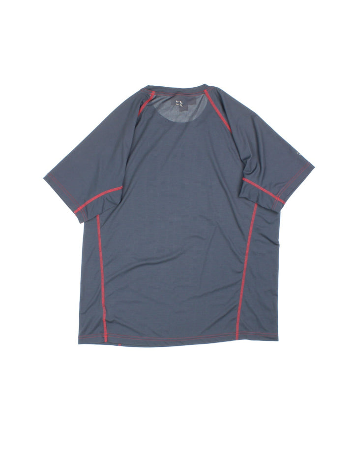 Rab Interval T-Shirt in a blue colourway with red stitching and small logo printed on the front.