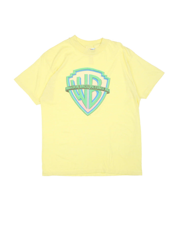 Vintage Warner Bros Picture Inc Logo T-Shirt in a neon yellow colourway with the logo printed on the front.