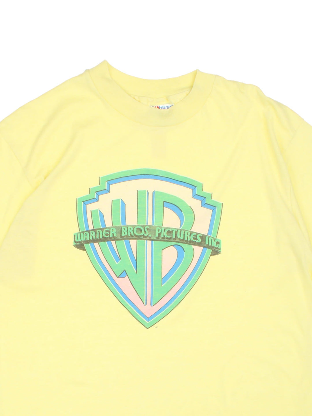 Vintage Warner Bros Picture Inc Logo T-Shirt in a neon yellow colourway with the logo printed on the front.