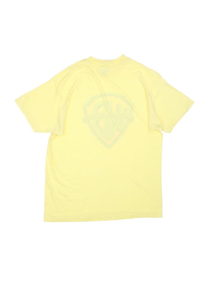 Vintage Warner Bros Picture Inc Logo T-Shirt in a neon yellow colourway with the logo printed on the front.