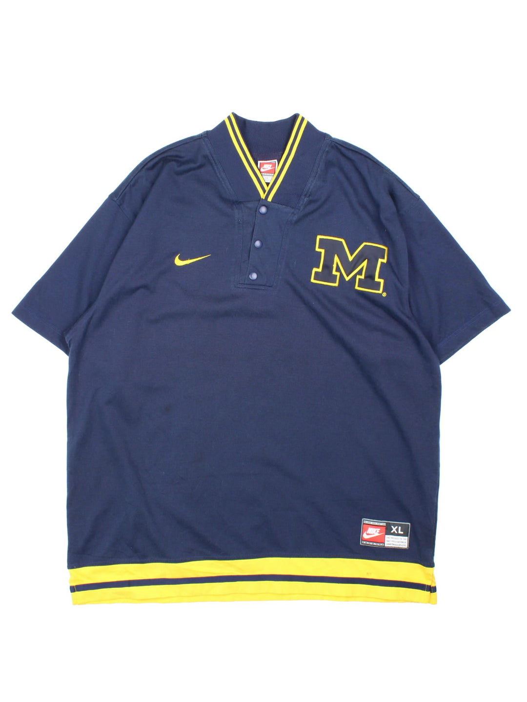 Michigan University Nike Wolverines Basketball Shooting Training Top in a navy blue and yellow colourway, button up collar and has the logos embroidered on the front.