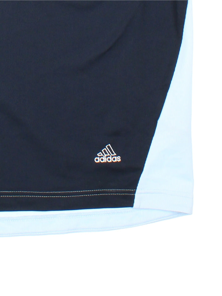 Adidas Polo Shirt in navy blue with light blue stripe detail and logo embroidered on the front.