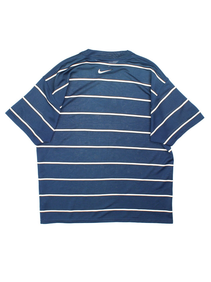 Vintage 90's Nike Training Top in a navy blue and white striped colourway with the swoosh logo embroidered on the front.