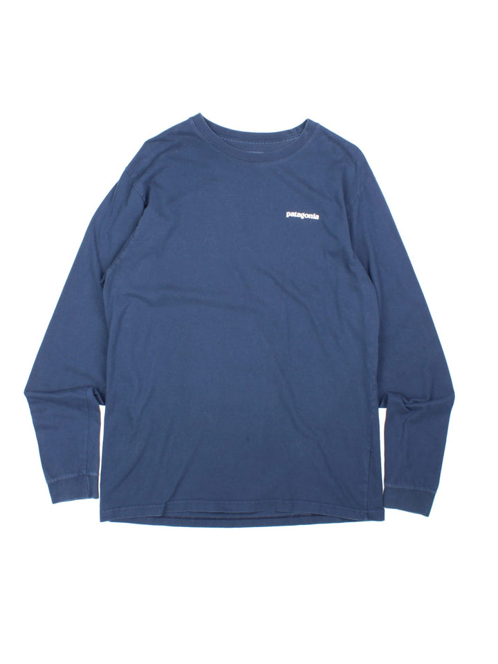 Patagonia Long-Sleeve T-Shirt in a navy blue colourway with the logo printed on the front and back.