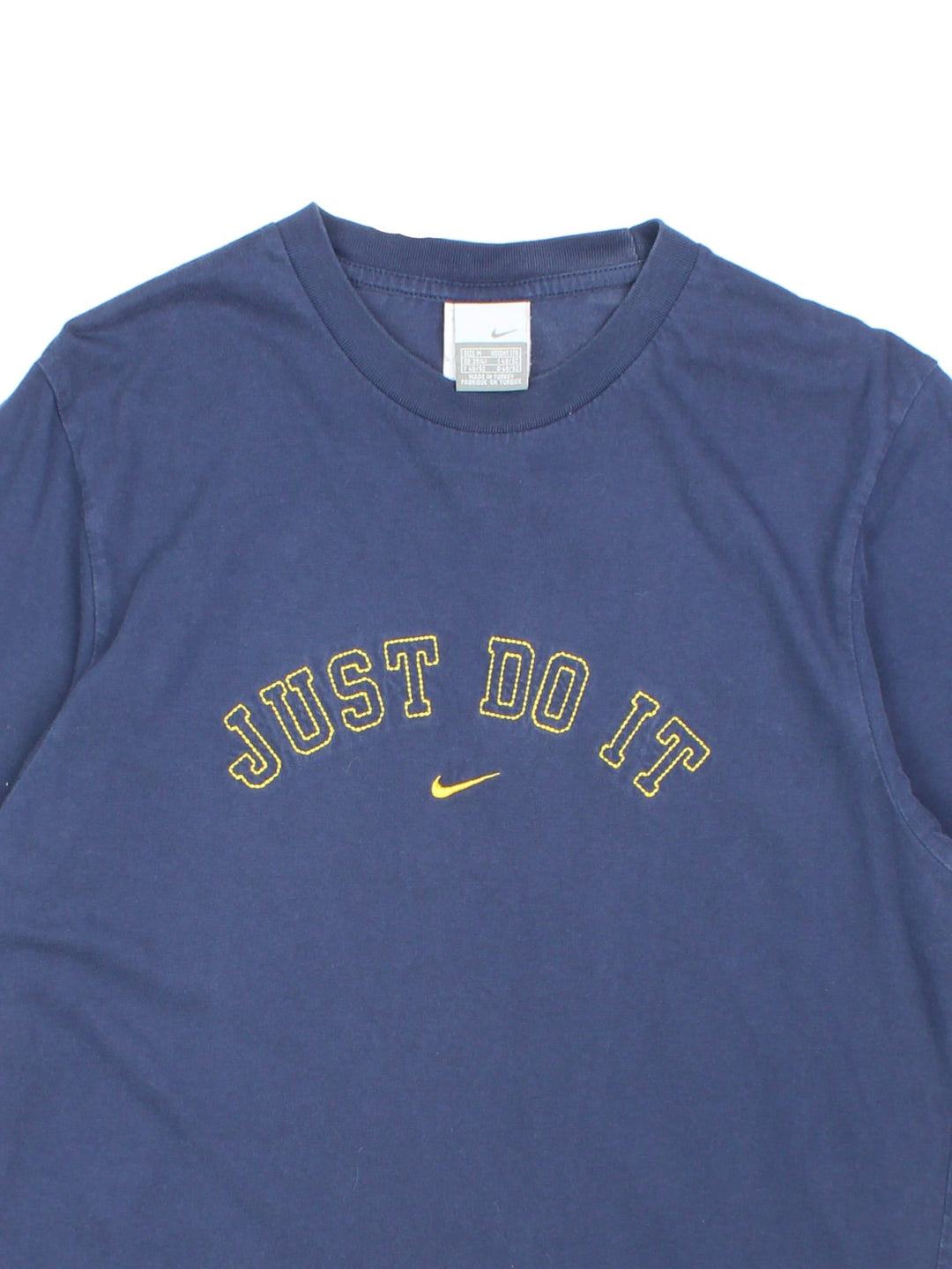 Vintage Nike T-Shirt in a navy blue colourway with the logo and graphic printed on the front.