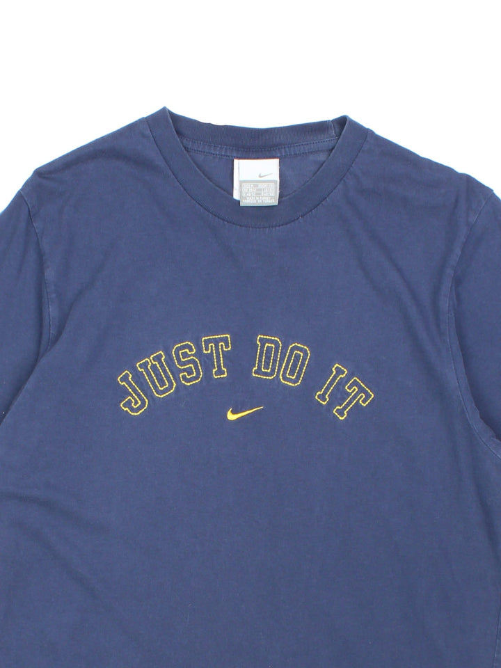 Vintage Nike T-Shirt in a navy blue colourway with the logo and graphic printed on the front.