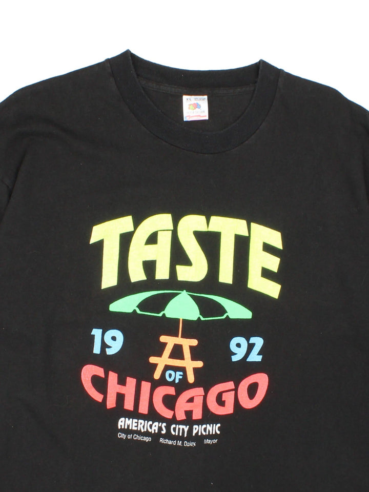 Vintage 1992, 90s LG Taste Of Chicago T-Shirt in black with graphic printed on the front.