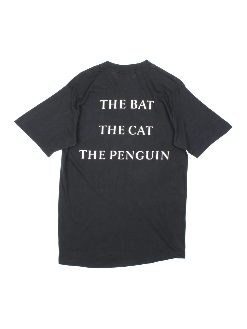 Original Vintage 1992 Batman Returns single stitch T-Shirt in black with the logo on the front and 'The Bat The Cat The Penguin' graphic printed on the back.