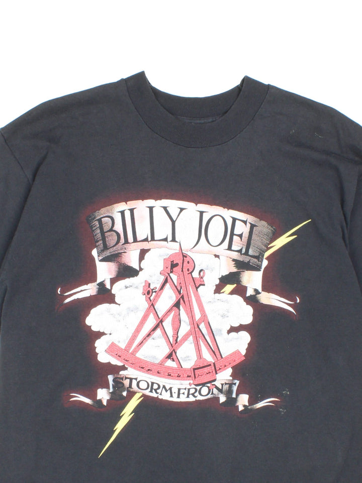 Vintage Billy Joel 1990 Storm Front Tour T-Shirt in black with graphic printed on the front and back.