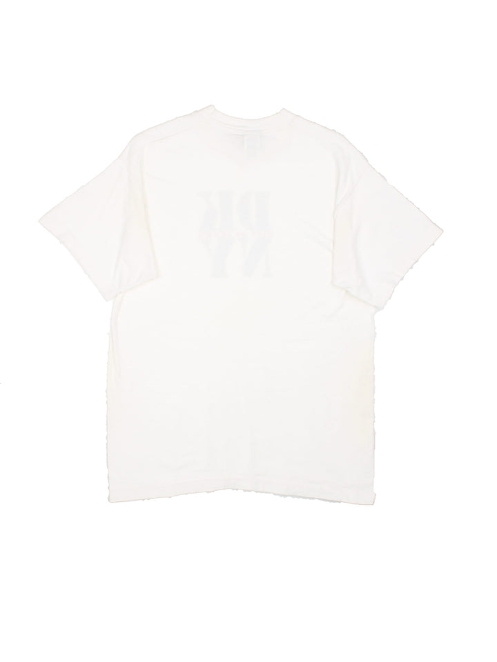 Vintage DKNY City of Jeans T-Shirt in white with the logo graphic printed on the front.