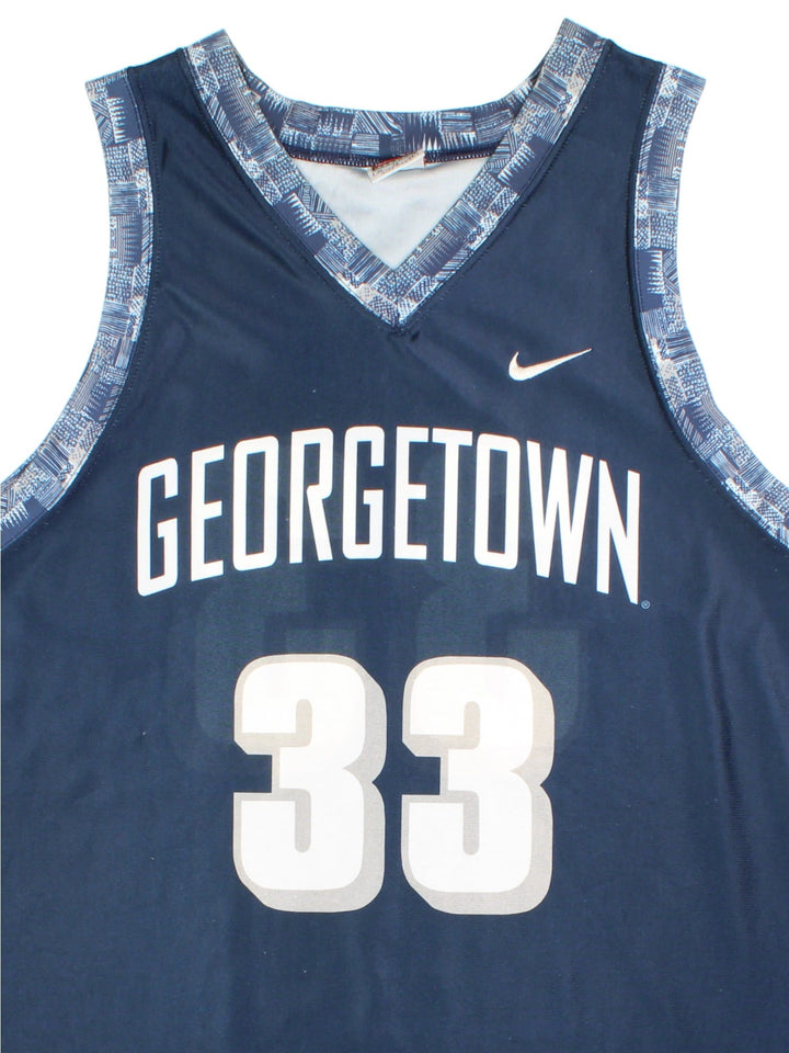 Georgetown Hoyas Nike Basketball Jersey in the blue home kit colourway, features team name across the front and traditional Patrick Ewings number #33.